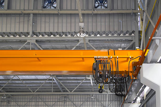 istock Overhead crane or lifting equipment inside factory or warehouse. 2227353267