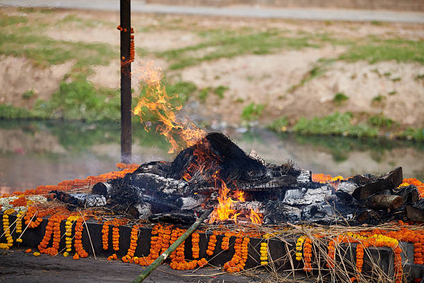 istock Smoldering funeral pyre for cremation ceremony at Pashupatinath Temple complex, Nepal 2227354863