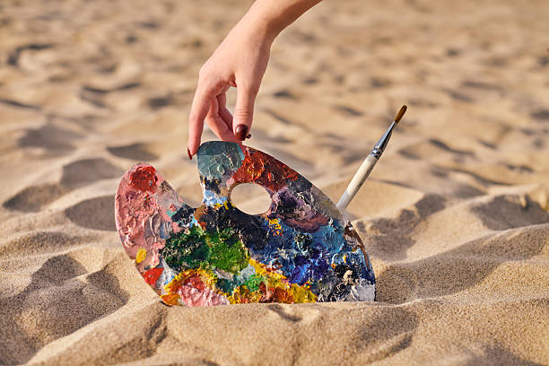 istock Artist palette in sandy beach setting 2227354893