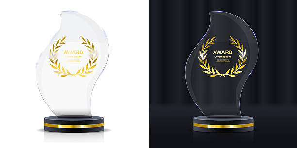 istock Crystal glass trophy with golden lettering on square stand. Realistic premium award for competition, team success, or recognition of talents. 3D vector cup with transparent glossy design. 2227356451