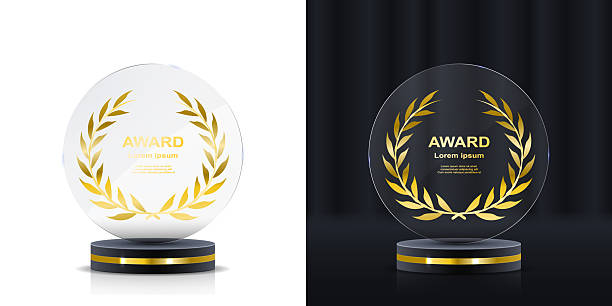 istock Shiny transparent crystal trophy with gold engraving. Vector award icon for winners and high performers. Polygon cut glass with elegant pedestal for sport and business events. 2227356491