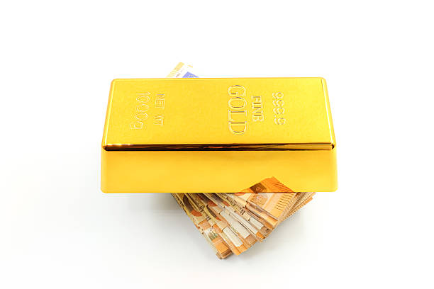 istock A gold bar on a stack of 50 euro bills. 2227357186