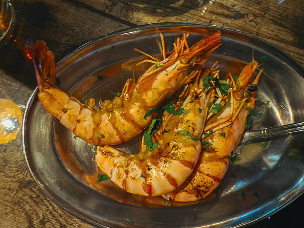 Mediterranean seafood platter with fish, langoustines, octopus, mussels, grilled vegetables, hummus and dips served in traditional style