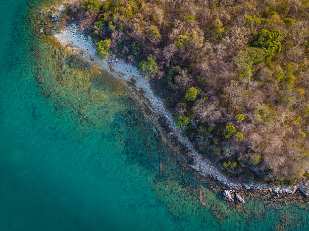 istock Aerial view white sand beach wave tropical island turquoise water 2227357589