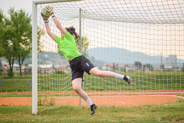 istock Teenager goalkeeper making a save during a soccer match 2227359565