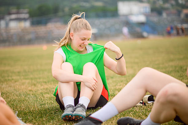 istock Soccer player pulling her jersey away from her sweaty body 2227359568