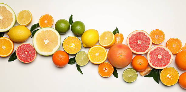 istock Different citrus fruits on white background, top view 2227361099