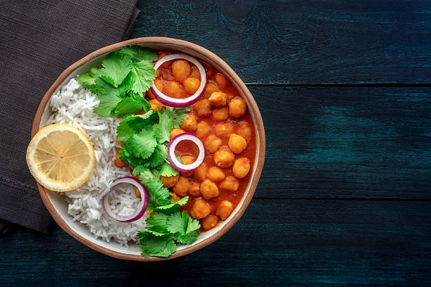 istock Chana masala, chickpea curry, traditional Indian dish, overhead flat lay shot 2227368423