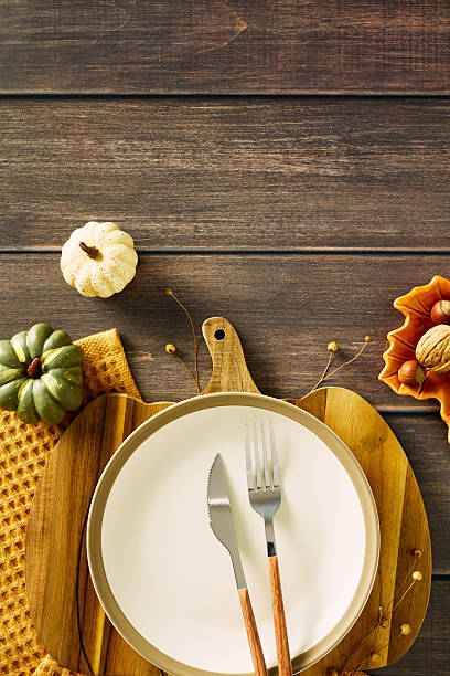 istock Elegant table setting with plate, cutlery, and pumpkins. Autumn, Fall, Thanksgiving dining concept. 2227368787