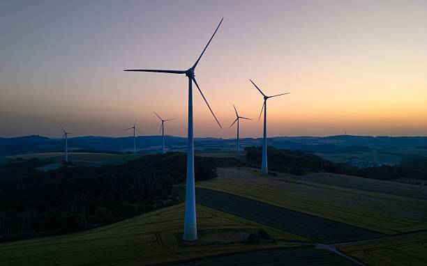 istock Wind turbines at sunset in a serene landscape. 2227369600