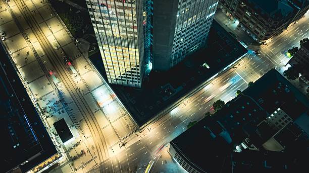 istock Aerial city intersection at night with illuminated streets. 2227369609