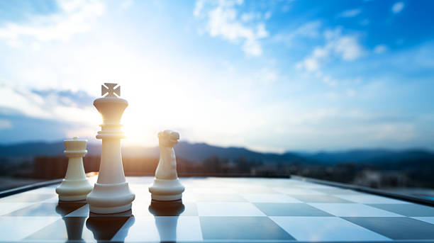 istock Chess king, pawn and knight on city background 2227370302