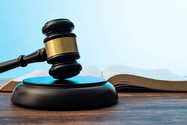 istock Gavel and open book on the table 2227371016
