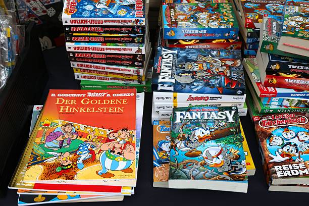 Donald Duck Disney comic books and Asterix comics in German language at Altstadtsauber flea market in Klagenfurt, Austria.