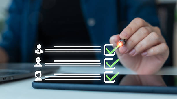 istock Close-up of a hand selecting candidates using a digital checklist interface on a tablet, symbolizing recruitment technology, applicant evaluation, and a smart hiring process. 2227379007