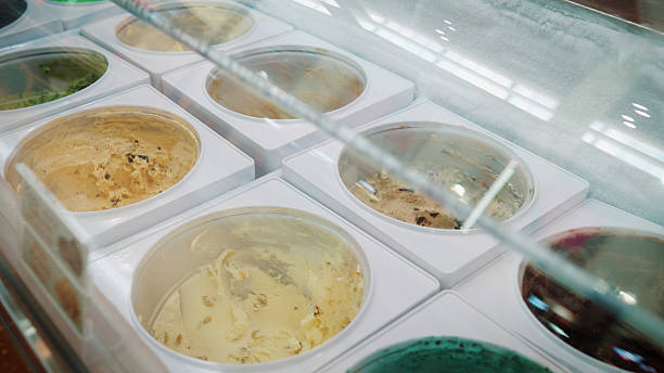 Many flavors of ice cream are in the ice cream freezer