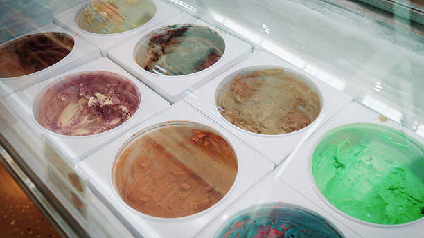 Many flavors of ice cream are in the ice cream freezer