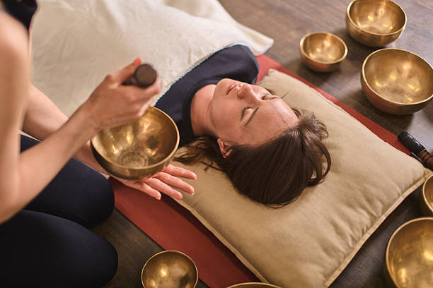 istock Sound healing with singing bowls in calming setting 2227383164