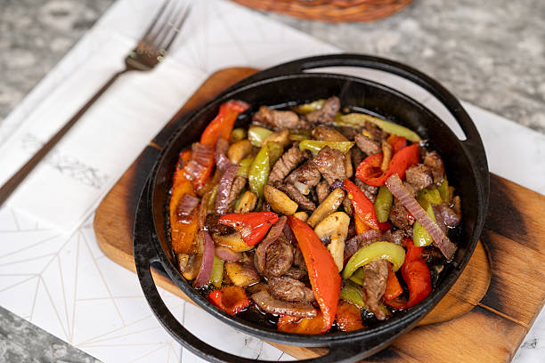 istock Top view tenderloin with vegetables. dining table view. 2227384027