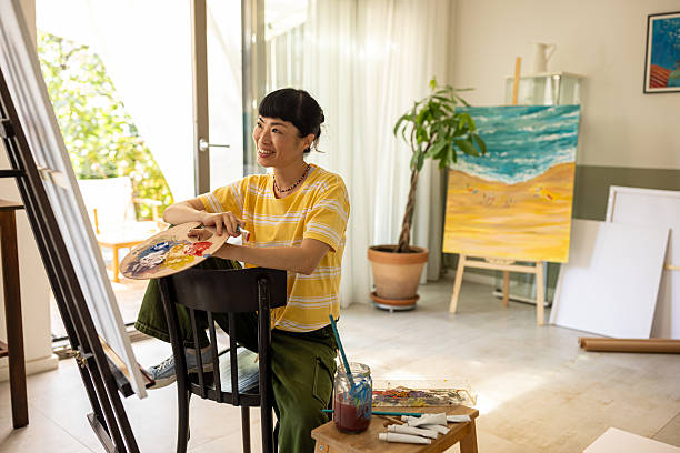 istock Creative woman working on a canvas 2227388819