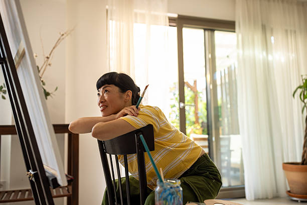 istock Asian artist working on a new canvas 2227388933