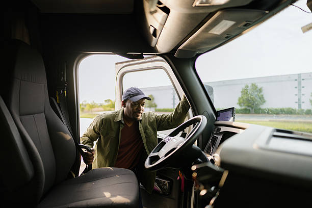 istock Truck driver entering his cab and starting his workday 2227389333