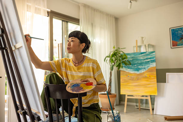 istock Asian artist working on a new canvas 2227390417