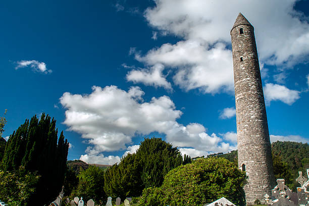 The ancient cemetery at Rock of Cashel, County Tipperary, Ireland. Featuring historic Celtic crosses, tombstones, and monuments, this site holds centuries of history within its medieval walls.