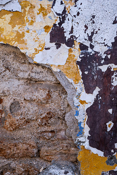 istock Aged colorful wall with flaking paint and plaster 2227398391