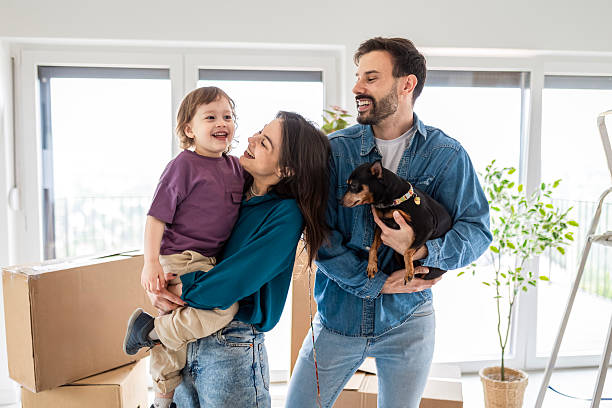 Excited Family Starting a New Chapter with Cardboard Boxes