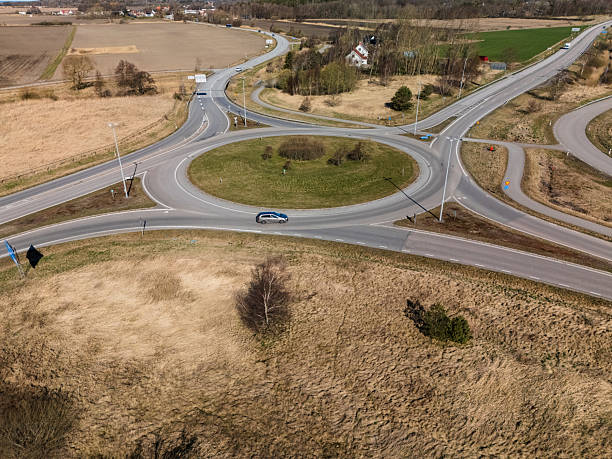 istock Aerial view of traffic roundabout surrounded by dry fields.. 2227400784