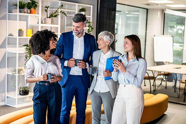 istock Business people enjoying coffee break in modern office 2227402280