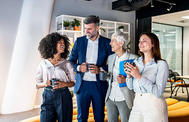 istock Business people enjoying coffee break in modern office 2227402995