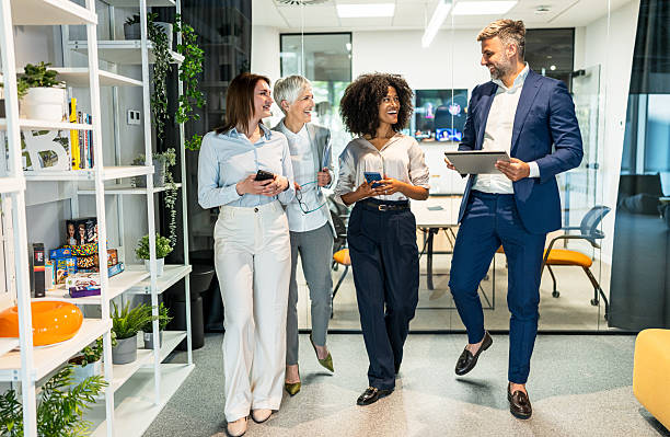 istock Business team walking and talking in modern office 2227403201