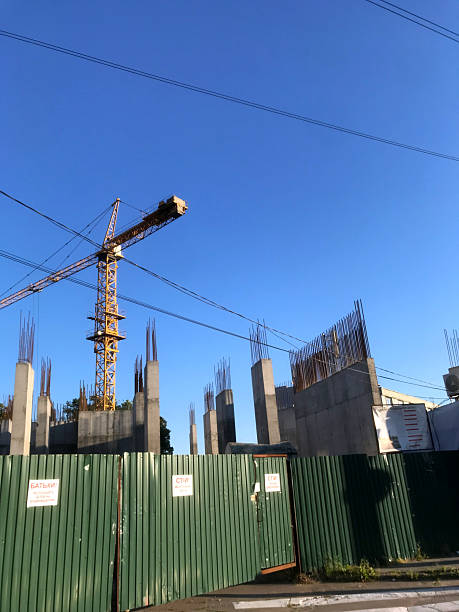 istock Construction of a new building under clear blue sky 2227403431