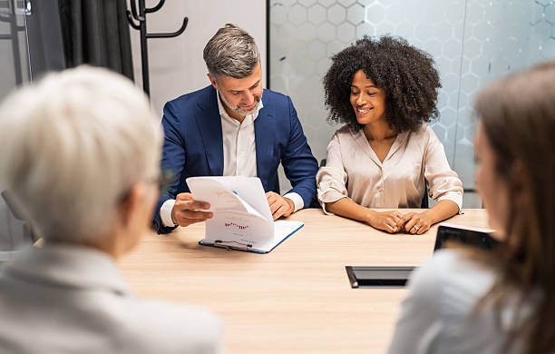 istock Business people having meeting in boardroom, analyzing financial documents 2227403665