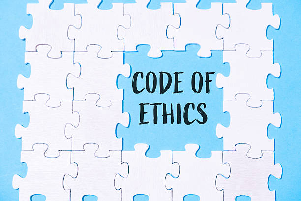 istock Puzzle pieces forming a message about ethics on a blue background with a focus on integrity 2227404717