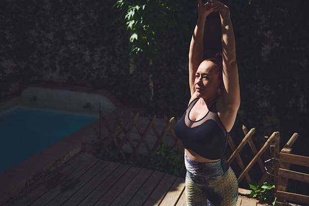 istock Woman Practicing Yoga Outdoors in a Serene Natural Setting 2227404836