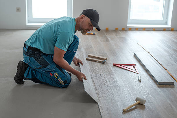 istock Floating floor work. The worker inserts the board of vinyl plank to the click system of Floating floor. 2227407063