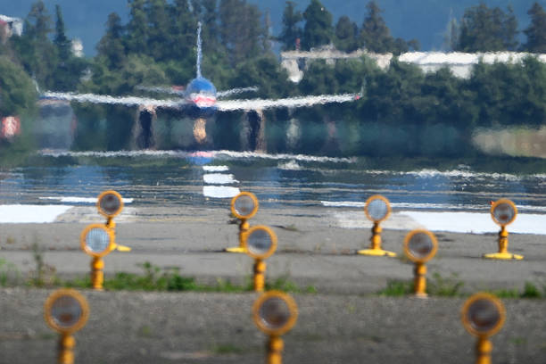 Airplane taking off from airport runway. Blurred background