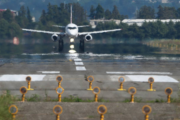 Airplane taking off from airport runway. Blurred background