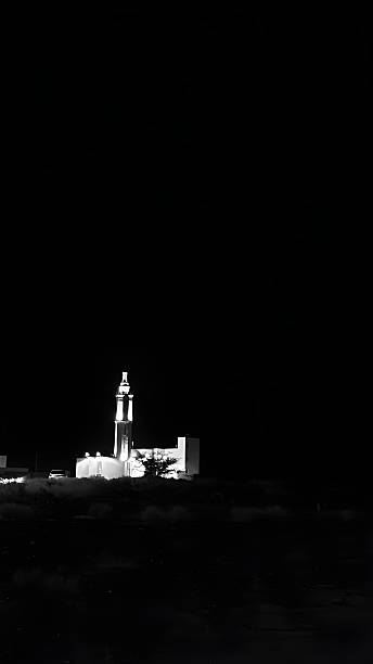 istock A mosque on a mountain in black and white at night 2227410789