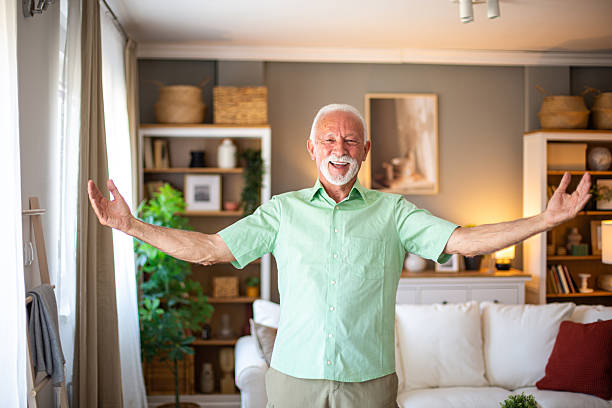 istock Happy senior man embracing life at home 2227412869