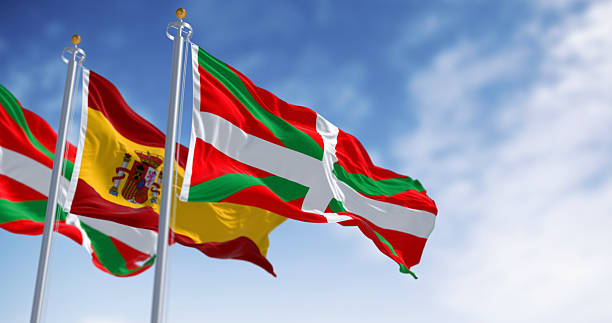 istock Basque Country and Spanish flags waving in the wind 2227414925