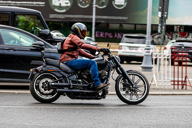 Biker on motorcycle in traffic in Bucharest city