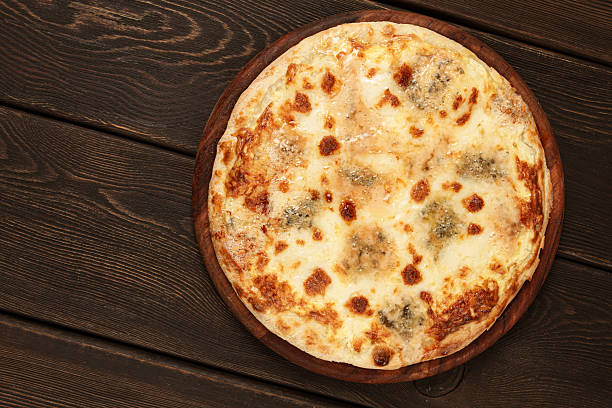 Freshly baked cheese pizza, with a golden crust and bubbling melted cheese, white pizza, on a wooden board, homemade, no people,