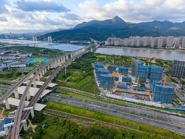 istock Aerial View of Modern Bridge and Urban Construction Site 2227415844