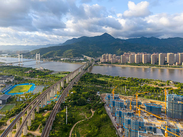 istock Aerial View of Modern Bridge and Urban Construction Site 2227415880
