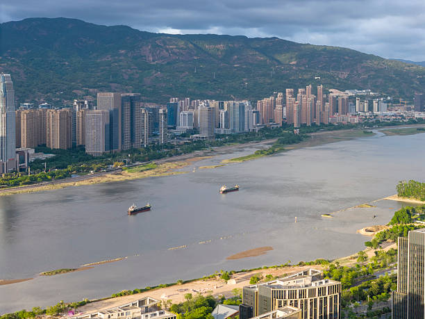 istock Urban Landscape with Riverfront High-Rise Buildings 2227415903