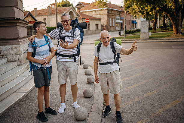 istock Multi-generation family visiting city carrying backpacks while on vacation 2227426011